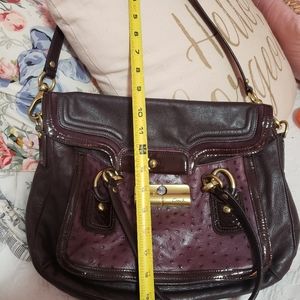Coach burgundy purse with gold accents